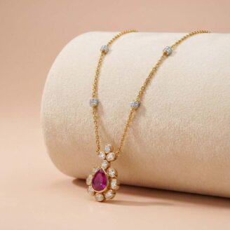 Elegant Pear-Cut Ruby Floral Pendant in 18K Gold chain
